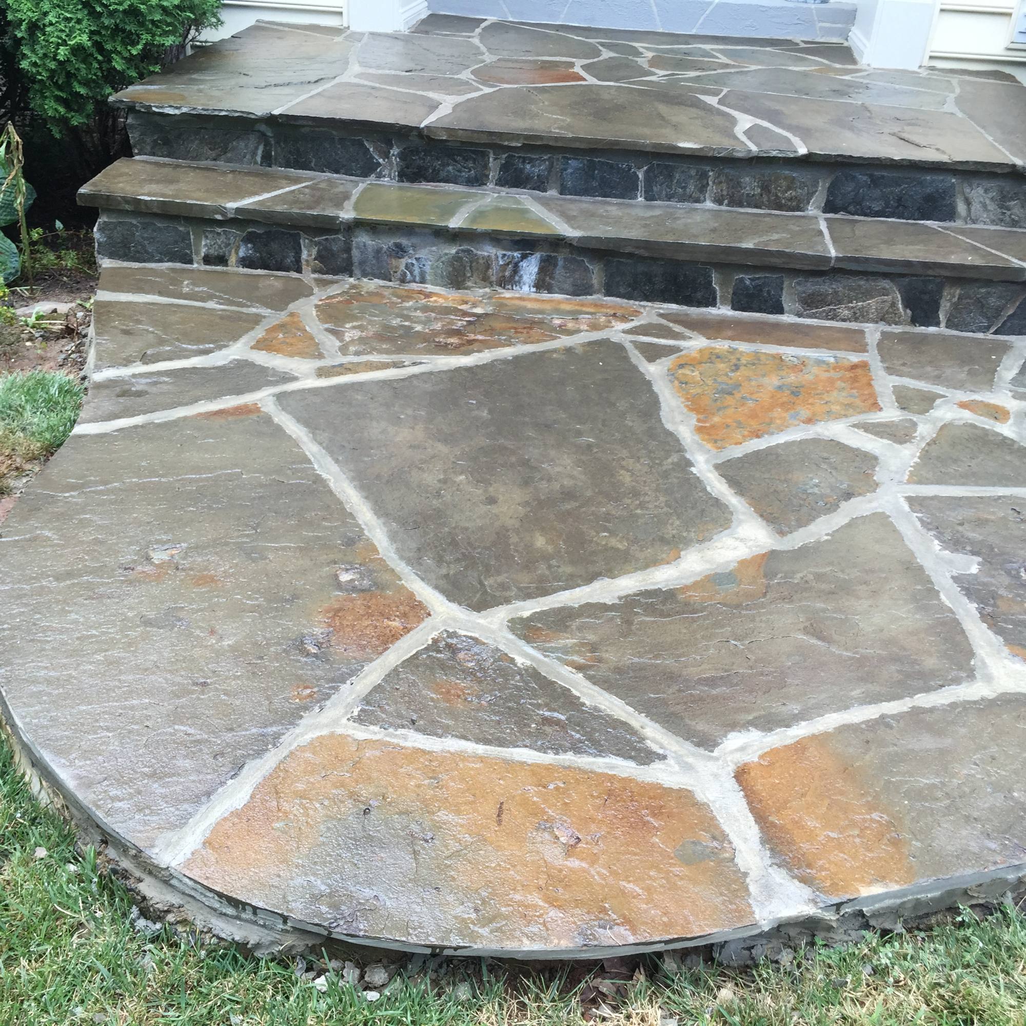 Rounded flagstone entry steps and landing at a Northern Virginia front door
