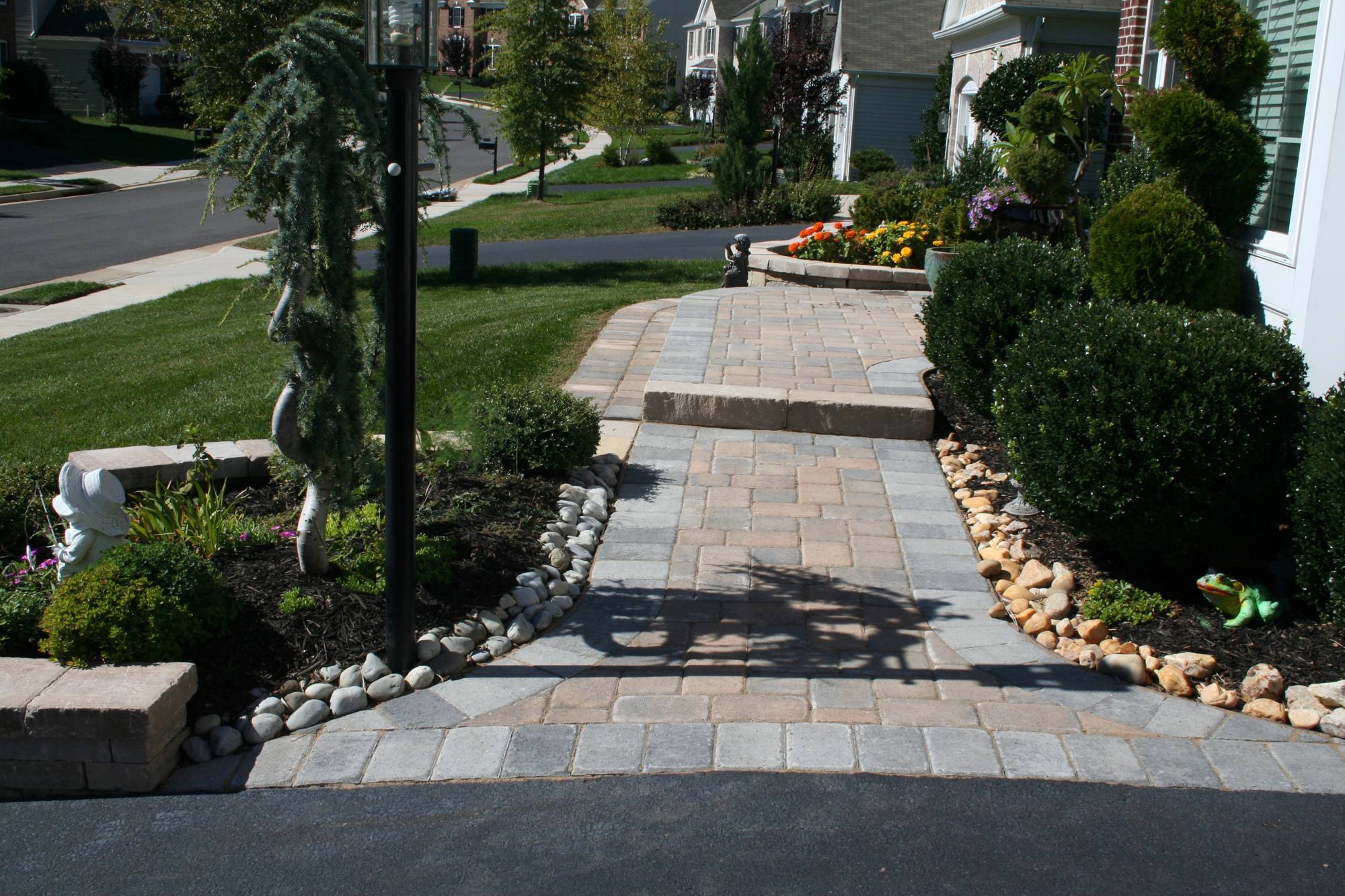 Paver front walkway with river-rock border and landscaping in Northern Virginia