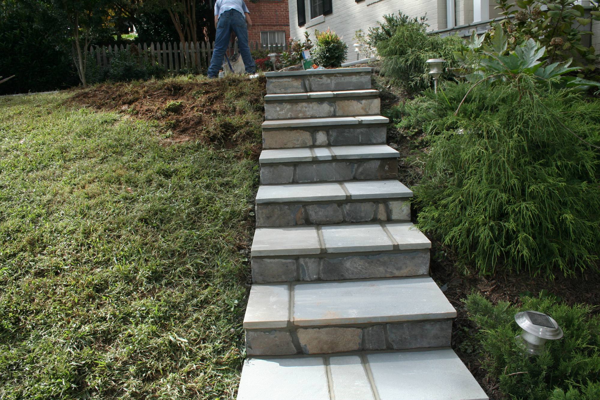 Natural stone slab steps climbing a landscaped slope in Northern Virginia