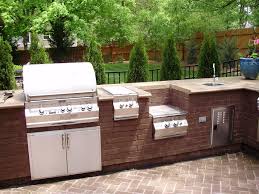 Stainless Steel and Brick Outdoor Kitchen, Grill and Bar